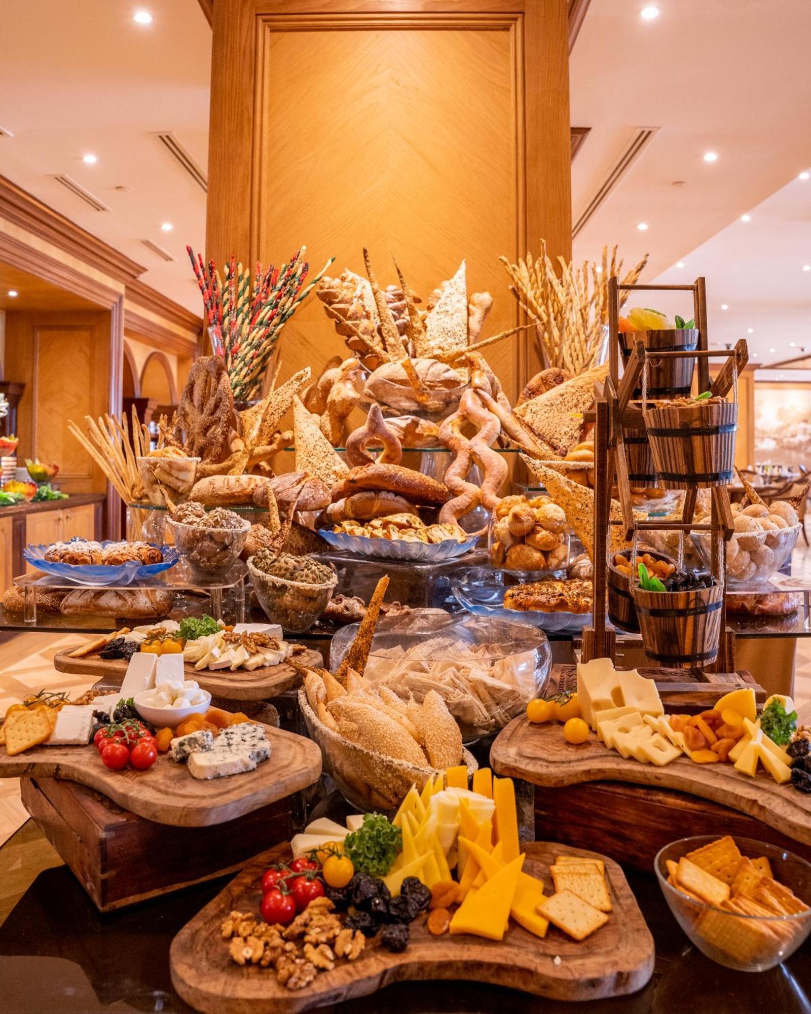 The Regency Hotel Kuwait Kuwait City Exterior photo A cheese display at a buffet